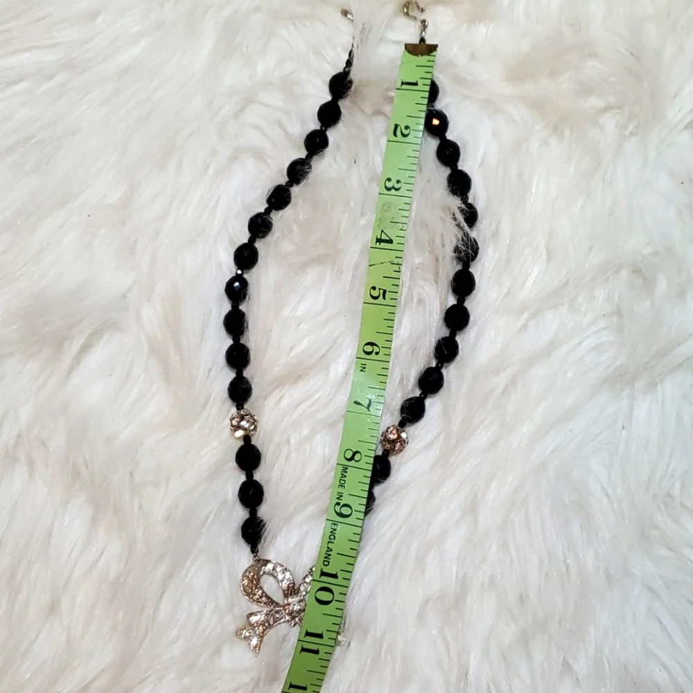 Boutique black, silver tone with a bling bow necklace